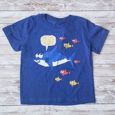 Blue Jem Kids Shirt With A Shark Leading School Of Fish. Shirt Reads "Too Cool For School". Baby Shark. Size 4 Blue Fun T-shirt For Playtime, Blue Cotton Top With Cartoon Print, Playful Blue T-shirt For Playtime, Blue Short Sleeve Shirt With Cartoon Print, Blue Fun T-shirt For Playwear, Fun Blue T-shirt For Playwear, Fun Blue T-shirt For Playtime, Blue Short Sleeve T-shirt For Playwear, Playful Blue T-shirt For Playwear