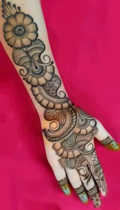 a henna tattoo is shown on someone's hand