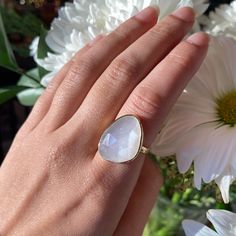 Calling all pearl lovers! This large white moonstone cocktail ring is set in 925 Sterling silver with a thick and lasting gold plating. This natural moonstone has a soft, iridescent feel to it, white still shining a beautiful pearly tone. Casual, stunning, stackable! In the photo with the three rings, the white moonstone is pictured on the middle finger. White Moonstone 925 Sterling silver Vermeil gold plating (2.5 micron) How To Clean Silver, Three Rings, White Moonstone, Professional Jewelry, Cleaning Jewelry, Cocktail Ring, Gold Plated Jewelry, Large White, Jewelry Plate