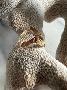 Cool and hip 10k laser cut detailed chevron ring. Due to the shape the ring fits a 5.5 or 5 finger. Hallmarked 10k 1.4g