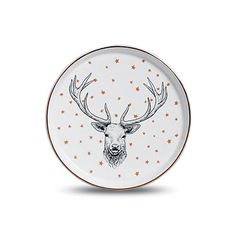 a white plate with a deer head and stars on the side, in gold foil