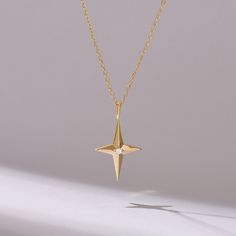 Indulge in celestial elegance with our Tiny Diamond Cross Star Necklace, meticulously crafted in 14k Solid Gold. This dainty piece features a delicate compass pendant adorned with sparkling diamonds, adding a touch of sophistication to any ensemble. Handmade with care, it serves as a timeless symbol of guidance and faith, making it the perfect accessory for Her. Elevate your jewelry collection with this exquisite necklace, designed to capture hearts and inspire wonder with its celestial allure. Elegant Star-shaped Diamond Cut Necklace, Elegant Star Shaped Diamond Cut Necklace, Star-shaped Celestial Jewelry For Formal Events, Celestial Star-shaped Jewelry For Formal Occasions, Celestial Star Jewelry For Formal Occasions, 14k Gold Star-shaped Necklace For Anniversary, Elegant 14k Gold Star Necklace, Gold Star-shaped Jewelry With Diamond Cut, 14k Gold Star-shaped Diamond Cut Jewelry