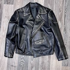 Vintage Leather Motorcycle Jacket 90s Black Studded Biker Punk Coat L/Xl Era Circa: 80's/90's Rn# Date: N/A Designer: Unmarked Made In: Unmarked Color(S): Black Material(S): Real Leather Condition: 7 Marked Size: Unmarked Fits Like: L/Xl Shoulder: 17.5 Sleeve: 23 Bust: 42 Waist: 36 Hip: - Length: 22 Back/ 23 Front Lined: Yes (Extra Zip In Lining Is Not Included) Stretch: No Clipped On Model: No Stock : 4515-2 Notes: - Zip Closure - Hip Pockets - Two Inside Pockets - Belt Loops *********Vintage Condition Rating Chart******** Mint (10): Item Is As Pristine As It Was Originally Made. Shows No Signs Of Wear. Could Have Original Tags Near Mint (9): Item Shows Only The Slightest Signs Of Lig Alternative Studded Outerwear For Fall, Alternative Studded Fall Outerwear, Edgy Studded Winter Outerwear, Alternative Style Leather Jacket With Rivets For Fall, Fall Streetwear Biker Jacket With Studs, Fall Studded Biker Jacket For Streetwear, Winter Leather Jacket With Rivets In Alternative Style, Winter Alternative Leather Jacket With Rivets, Alternative Style Leather Jacket With Rivets For Winter