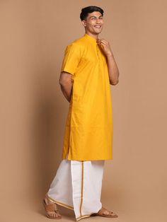 VASTRAMAY Men's Mustard Cotton Kurta And Mundu Set Add a touch of tradition to your wardrobe with this mustard cotton kurta and mundu set from VASTRAMAY. Perfect for special occasions or festive events, this set offers comfort and style. The kurta features a classic design with intricate detailing, while the mundu adds an elegant touch. Made from high-quality cotton, this set is easy to maintain and durable, ensuring long-lasting wear. Features: Mustard cotton kurta with intricate detailing Come Cotton Sherwani With Dabka Detailing For Puja, Cotton Sherwani With Dabka For Puja, Yellow Cotton Sets With Traditional Drape, Yellow Cotton Kurta With Dabka Detail, Yellow Cotton Kurta With Dabka, Yellow Cotton Kurta With Dabka Embroidery, Cotton Sherwani For Puja, Cotton Sherwani For Puja And Transitional Season, Traditional Mustard Cotton Kurta