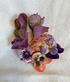 This one of a kind 4 inch vintage flower hat pin is trimmed with vintage pansy's, berries and flowers and crochet pieces.  The pin can be attached at any angle to a hat or to clothing. Whimsical Flower-shaped Mini Hats For Garden Party, Whimsical Flower Mini Hat For Garden Party, Handmade Multicolor Flower Brooches, Crochet Pieces, Beautiful Museum, Flower Hat, Flower Hats, Hat Pin, Vintage Hat