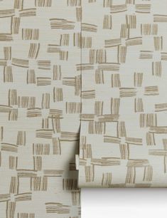 a close up view of a wallpaper with brown and white lines on the fabric