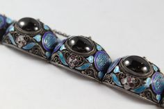 -Antique Chinese Sterling Sliver Enamel Filigree Black Jet? Bracelet -Total length: 7 in -Black jet? size:about 14.5 mm x 11 mm -Total weight: 51.7 g -Marked 925 -Have a safety lock Traditional Black Engraved Bracelets, Elegant Formal Bracelets With Inlay, Black Enamel Bracelets For Gifts, Black Enamel Bracelet Jewelry, Antique Black Bracelets For Formal Occasions, Black Enamel Bracelets Gift, Black Enamel Bracelet Gift, Elegant Silver Enamel Bracelets, Luxury Black Enamel Sterling Silver Jewelry