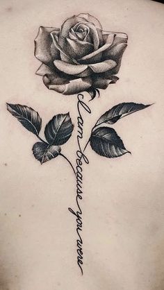 a woman's back with a rose and the words i love you in cursive