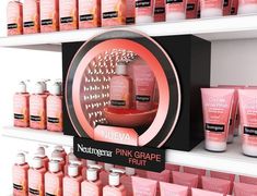 the shelves are filled with pink grapefruit products