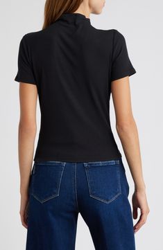 Made from soft and stretchy jersey, this figure-hugging top has a chic mock neck that elevates the look of any outfit. 20 1/2" length (size Medium) Mock neck Short sleeves 95% modal, 5% spandex Dry clean or machine wash, dry flat Imported Casual Mock Neck Top In Solid Color, Casual Mock Neck Top, Casual Stretchy Mock Neck Top, Casual Turtleneck Top In Elastane, Fitted Mock Neck Elastane Top For Work, Fitted Mock Neck Top For Work, Fitted Black Mock Neck Top In Elastane, Trendy Fitted Black Mock Neck Top, Black Elastane Turtleneck Top