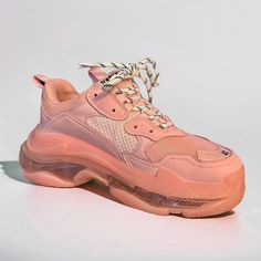 New Without Box. Peachy Pink Color. Embodying A Modern High-Tech Finish, These Triple S Sneakers Are Named For Their Three-Sole Construction. Embroidered At The Toe With The Shoe's Size, They Are Set Atop A Tpu-Injected Clear Sole, Creating A Cushy, Bubble Effect. Leather Free Rubber Complex 3-Layered Outsole Embossed Size At The Edge Of The Toe Embossed Logo On The Side Embossed Logo In The Back Triple S Rubber Branding On The Tongue 2 Laces Loops Including 1 Functional Lacing System Featuring 12 Fabric Eyelets Laces Recalling Hiking Boots' Laces Back Pull-On Tab And Tongue Pull-On Tab Textile Upper Round Toe Lace-Up Vamp Textile Lining Molded Rub Pink Lace-up High-top Sneakers With Textured Sole, Orange Lace-up Sneakers With Perforations, Luxury Pink Lace-up Platform Sneakers, Balenciaga Triple S Clear Sole, Pink Lace-up Sneakers With Lug Sole, Orange Balenciaga Sneakers, Balenciaga Shoes, Balenciaga Triple S, Eyelet Lace