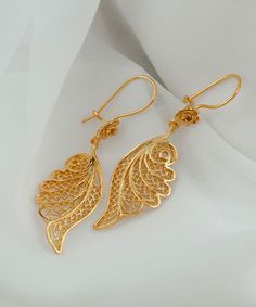 Gold Angel Wing Silver Dangle Earrings 925 Sterling Silver Gold Plated Filigree Floral Earrings Women Handmade Wing Drop Earrings Jewelry Edwardian earrings, anniversary gift her, best friend gift, sparkly earrings Material: 925 Sterling Silver 18K Gold Plated (NICKEL FREE) Length, Drop and Width: 5.5cm X 3.5cm X 1.6cm // 2.15 Inches X 0.6 Inches UPS - FREE, FAST AND TRACKABLE SHIPPING FOR ALL EU COUNTRIES AND USA. Embrace celestial elegance with our Gold Angel Wing Silver Dangle Earrings, a divine fusion of ethereal charm and artisan craftsmanship. Crafted from high-quality 925 Sterling Silver and delicately plated in gold, these enchanting filigree floral earrings are a testament to meticulous handmade artistry. The angel wing design adds a touch of celestial grace, symbolizing protectio Designer Earrings Gold, Gold Filigree Sterling Silver Earrings, Delicate Earrings With Intricate Design For Gift, Elegant Filigree Earrings For A Gift, Anniversary Filigree Dangle Earrings, Elegant Filigree Plug Earrings As Gift, New Gold Earrings Designs, Gold Earing Design New, Earrings Gold Design