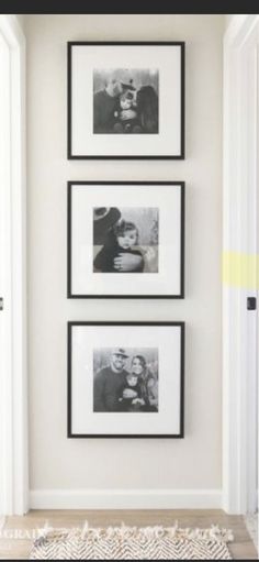 three black and white photos hanging on the wall above a rug in front of an open door