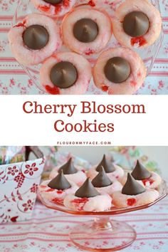 cherry blossom cookies with chocolate on top and in the middle, sitting on a glass platter