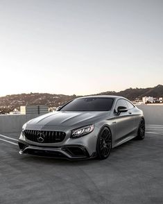 the mercedes s - class coupe is parked in an empty parking lot