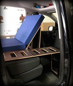 the back seat of a car with an open box on it