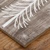 a piece of cloth with white feathers on it sitting on top of a wooden table