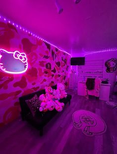 a living room with hello kitty wallpaper and pink lighting