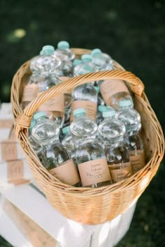 a wicker basket filled with lots of bottled water