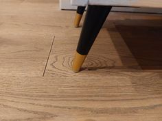 a close up of a piece of wood on the floor