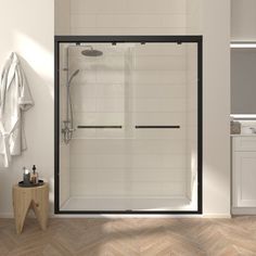 a bathroom with a walk in shower sitting next to a sink and a bathtub