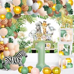 an animal themed birthday party with balloons, jungle animals, and giraffes