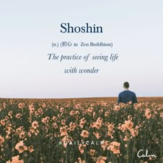 a man sitting in the middle of a field with flowers on it and an advertisement for shoshin