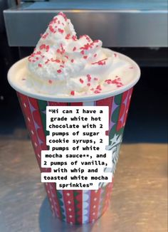 a cup filled with whipped cream and sprinkles