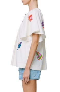 Colorful embroidery adds a vacation-ready twist to a woven cotton shirt in a relaxed silhouette. 24" length Button half placket Jewel neck Short sleeves 100% cotton Hand wash, dry flat Imported Asian & Pacific Islander Owned/Founded Embroidered Button-up Camp Shirt For Summer, Summer Embroidered Button-up Camp Shirt, Floral Embroidered Short Sleeve Camp Shirt For Summer, Short Sleeve Floral Embroidery Camp Shirt For Summer, Embroidered Summer Shirt For The Beach, Summer Floral Embroidered Collared Camp Shirt, Floral Embroidery Short Sleeve Camp Shirt For Summer, Embroidered Relaxed Fit Shirt For Summer, Casual Cotton Camp Shirt With Floral Embroidery