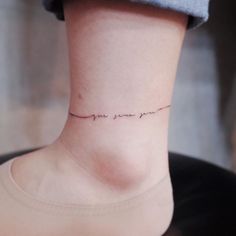 a woman's ankle with the words you are loved written on her left side