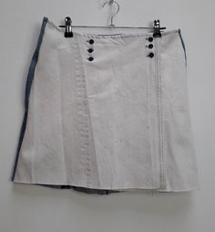 "a vintage white and blue wrap-style denim mini-skirt ✿ IMPORTANT INFORMATION: * excellent vintage condition * material: 100% cotton * size: medium - please check exact measurements below (they're there for your benefit!) * garment care: machine washable ✿ MEASUREMENTS (taken while item is lying flat, some measurements will need to be doubled): * length: 16\" (41cm) * waist: 14.5\" (37cm) * hips: 20\" (51cm) ✿ free UK shipping on orders over £100 with code STRAWBERRY free international shipping White Cotton Mini Denim Skirt, Fitted White Denim Skirt, White Denim Skirt, Short Length, Vintage Cotton Denim Mini Skirt, Vintage Cotton Mini Denim Skirt, White Cotton Retro Mini Skirt, Fitted White Denim Mini Skirt, White Mini Denim Skirt, White Fitted Denim Skirt With Pockets