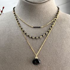 Beautifully faceted Black Spinel Briolette is hand-wrapped into a pendant and dangles from a long bar & link chain. Finished off with spring ring clasp and a dangle of gold beads. All gold-filled components. Length 28".The Black Spinel measures 15mm X 12mm. § Great to accent those pretty Holiday sweaters. § Great for layering! * All jewelry comes packaged in gift box with pink organza ribbon.* Care instructions also included. Elegant Black Gemstone Necklace, Minimalist Black Spinel Necklaces, Black Spinel Gemstone Necklace, Elegant Black Spinel Jewelry With Faceted Beads, Luxury Black Briolette Necklace, Briolette Necklace, Organza Ribbon, Holiday Sweater, Black Spinel