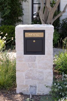 a mailbox in front of a white house