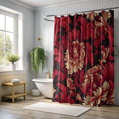 a red and black shower curtain in a bathroom next to a bathtub with a white rug