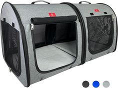 the dog house has three separate doors and is grey with black trimmings on each side