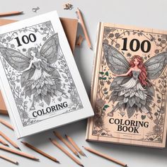 two coloring books with pencils next to them