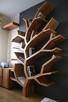 a bookshelf that is made out of wood and has several shelves on it