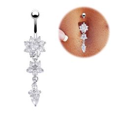 a pair of dangling belly rings with clear stones