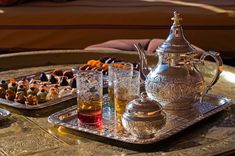 a tray with tea and cookies on it