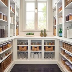 an organized pantry with lots of food in the cupboards and baskets on the shelves