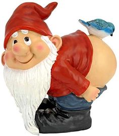 a statue of a gnome with a bird on his shoulder, sitting next to him