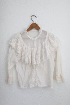 "material: cotton & lace used vintage condition.  shoulders:14 1/2 \" approx pit to pit:19 1/2\" sleeve:19\" length:21\"" Feminine Cotton Lace Patchwork Top, Feminine Cotton Tops With Lace Sleeves, White Lace Top With Ruffles, Feminine Cotton Lace Top, Vintage White Tops With Lace Trim For Daywear, Victorian Blouse With Lace Collar For Spring, White Victorian Blouse With Ruffles, Victorian Lace Collar Blouse For Spring, Spring Vintage Lace Top With Lace Trim