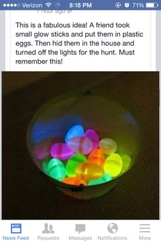 a bowl filled with glowing plastic eggs on top of a table