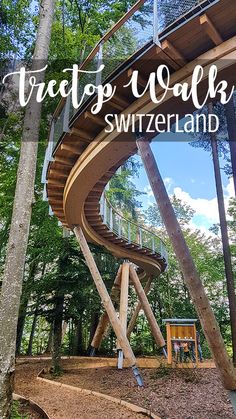 a wooden spiral staircase in the woods with text overlay that reads traps walk switzerland