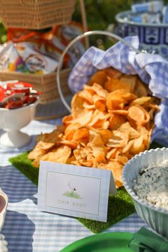 an assortment of chips and dips on a table