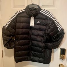 Nwt Adidas Essentials Down Jacket Men's Sz L Black Track Jacket For Winter Outdoor Activities, Black Outerwear With Pockets For Winter Sports, Adidas Winter Windbreaker With Long Sleeves, Adidas Long Sleeve Windbreaker For Winter, Adidas Urban Track Jacket For Winter, Urban Adidas Winter Track Jacket, Adidas Urban Winter Track Jacket, Black Sport Coat For Cold Weather And Winter, Black Sport Coat For Winter Cold Weather