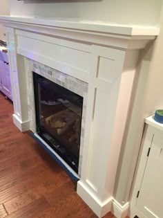 a fireplace with a tv above it in a living room