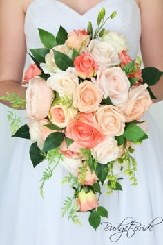 a bridal holding a bouquet of peach and white flowers