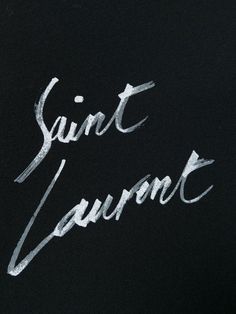 the word saint louis written in white chalk on a blackboard with some writing underneath it