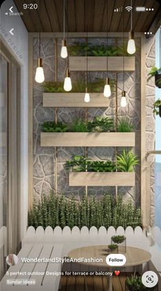 an image of a room with plants on the wall and lights hanging from the ceiling